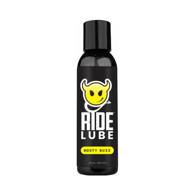 Black bottle of Ride Lube Booty Buzz with yellow devil logo and bold white text on label, 4.2 oz size.