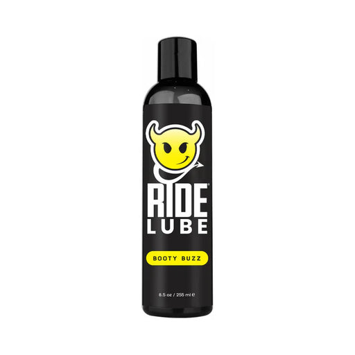 Black bottle of Ride Lube Booty Buzz silicone-based personal lubricant with yellow devil smiley logo and bold white text.