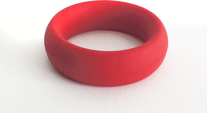 Red flexible cock ring with smooth surface and thick width, designed for comfortable all-day wear.