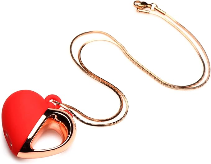 Red silicone heart pendant with rose gold handle on a long rose gold chain necklace.