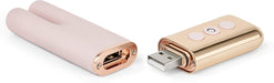 Le Wand Deux mini vibrator in soft pink with rose gold USB charger and control buttons shown separately.