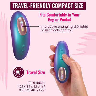 Compact Love To Love Dreamer in iridescent berry held in hand, highlighting travel-friendly size and LED mode controls.