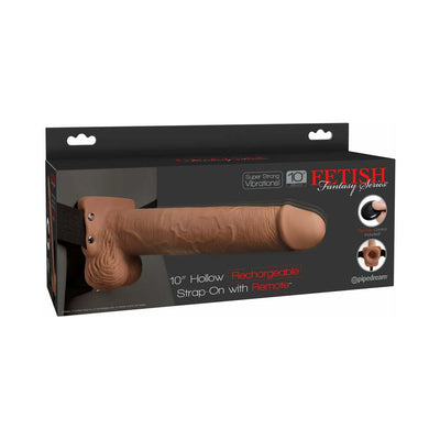 Tan 10-inch hollow rechargeable strap-on with remote control in adjustable harness, displayed in black packaging.