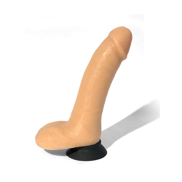 Realistic flesh-toned silicone adult toy with suction cup base, designed for versatile hands-free use.