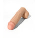 Realistic flesh-tone silicone dildo with detailed head and textured base on white background
