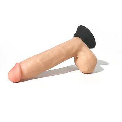 Realistic silicone adult toy with suction cup base in natural skin tone, designed for versatile use and comfort.