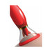 Close-up of a red and gold-accented intimate pleasure device with a clear suction cup and motorized tongue feature.