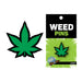 Green enamel lapel pin shaped like a marijuana leaf with black outline on branded Wood Rocket backing card.