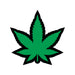 Green enamel lapel pin shaped like a marijuana leaf with black outline on white background.