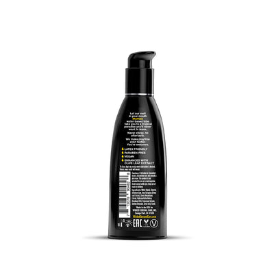 Black pump bottle of Wicked Aqua water-based lube with mango flavor and ingredient details on the back label.