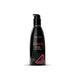 Black pump bottle of Wicked Sensual Care watermelon flavored water-based intimate lubricant, 2 oz with pink watermelon graphic.