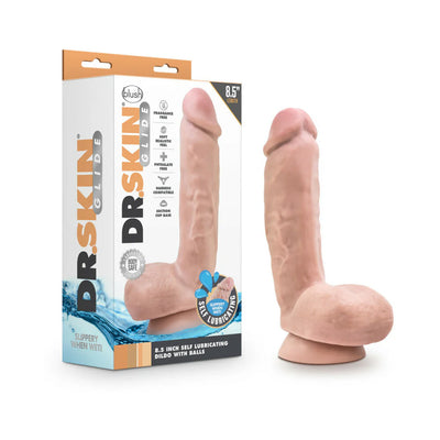 Chocolate-colored 8.5-inch realistic dildo with balls and suction cup base next to its Dr. Skin Glide packaging.