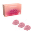 Three small rose-colored Womanizer Type A replacement stimulation heads with matching packaging box.