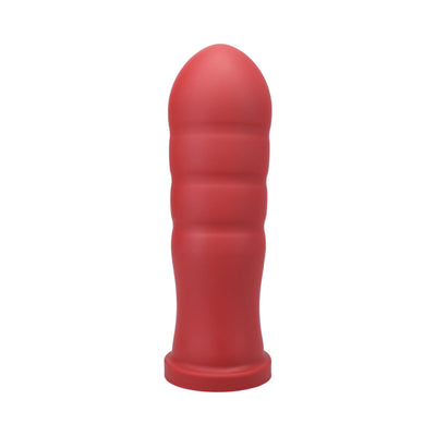 Large red silicone textured toy with rounded tip and ridged body, standing upright on a white background.