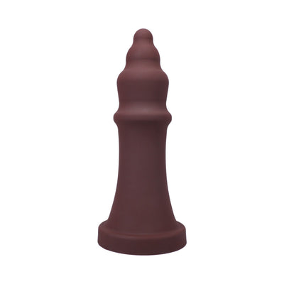 Dark brown silicone pleasure device with tiered, textured design and wide base, standing upright on white background.