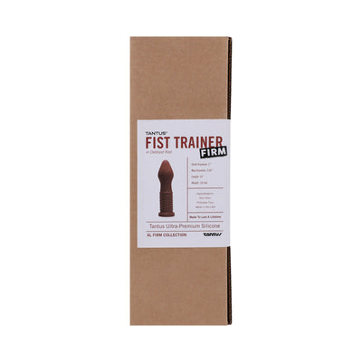 Tantus Fist Trainer firm in oxblood red with ribbed shaft, packaged in a simple brown box with product label.