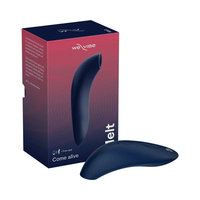 We-Vibe Melt clitoral suction stimulator in navy blue with its matching product box featuring wave design and branding.