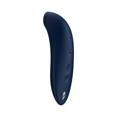 Sleek navy blue We-Vibe Melt clitoral stimulator with curved design and two-button control on white background.