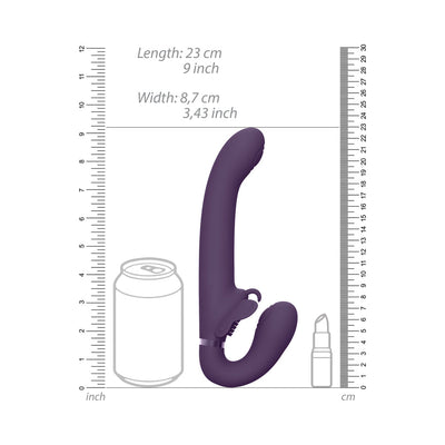 Purple silicone strapless strap-on with curved design, shown next to a soda can and lipstick for size comparison.