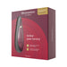 Womanizer Premium 2 clitoral stimulator in burgundy packaging with product image and luxury branding details.