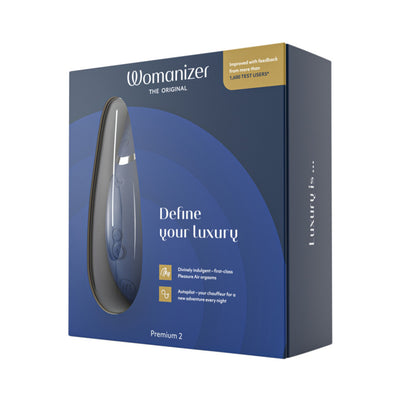 Womanizer Premium 2 clitoral stimulator in sleek black packaging with blue accents and product features highlighted.