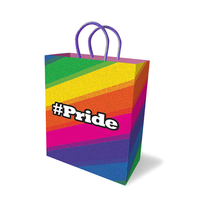 Colorful #Pride gift bag with rainbow stripes and purple woven handles, featuring bold #Pride text on front.