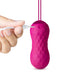 Hand plugging USB charger into textured pink Lush Carina insertable bullet vibrator with pull loop.