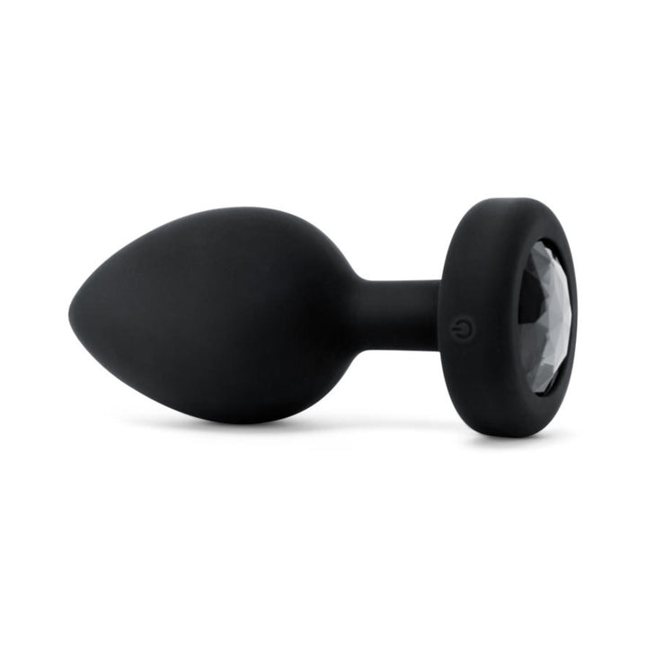 Black silicone vibrating plug with a faceted jewel base and smooth, tapered shape.
