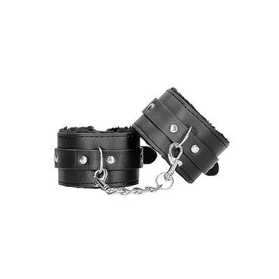 Black plush-lined bonded leather hand cuffs connected by a silver chain and clasp for adjustable restraint.
