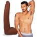 Dark brown 11-inch dual density dildo with lifelike texture and suction cup next to shirtless man posing in gray underwear.