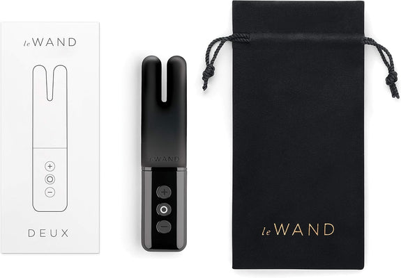 Le Wand Deux black dual-ended mini vibrator with control buttons, packaging box, and black drawstring storage pouch.