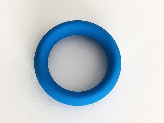 Blue flexible silicone cock ring with smooth finish, designed for comfortable all-day wear and enhanced performance.