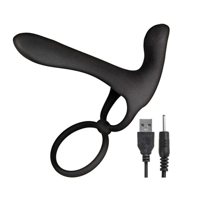 Black silicone dual-ring enhancer with curved stimulator and USB charging cable on white background