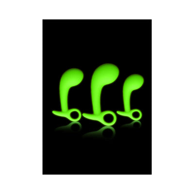 Set of three green glow-in-the-dark prostate massagers in small, medium, and large sizes with ergonomic curved design.