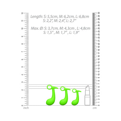 Set of three green glow-in-the-dark prostate plugs in small, medium, and large sizes with measurement scales and lipstick for size reference.