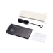 Le Wand Black Obsidian crystal yoni egg set with storage pouch, care guide, and instruction booklet on white background.