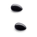 Two polished black obsidian yoni eggs with smooth, glossy surfaces on a white background.