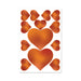 Sheet of caramel-colored edible heart-shaped pasties and pecker wraps on a white background.