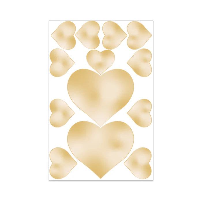 Sheet of beige heart-shaped edible nipple pasties and pecker wraps in various sizes on white background.