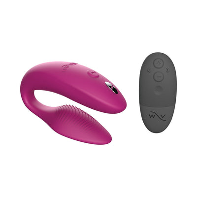 Magenta We-Vibe Sync couples vibrator with textured silicone and black remote control with multiple buttons.