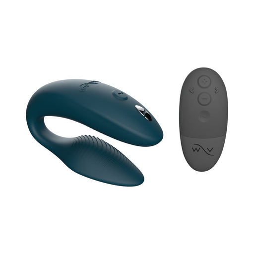 Green velvet We-Vibe Sync couples vibrator with textured silicone and matching remote control on white background.
