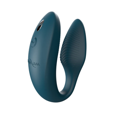 We-Vibe Sync couples vibrator in green velvet silicone with curved adjustable design and textured surface.