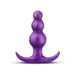 Purple anal plug with three graduated beads and a curved flared base for secure, comfortable wear.