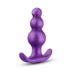 Purple anal plug with graduated bead design and curved flared base for secure, comfortable wear.