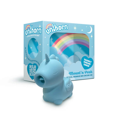 Blue unicorn-shaped vibrator with pointed flicking tongue next to matching rainbow-themed packaging box.