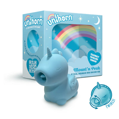 Blue unicorn-shaped vibrator with a twirling tongue feature displayed next to colorful packaging with rainbow design.