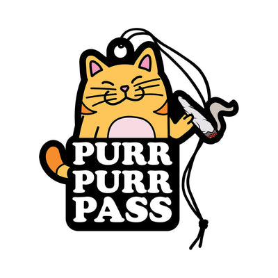 Cartoon orange cat air freshener with "Purr Purr Pass" text and a hanging string, scented with green grass.