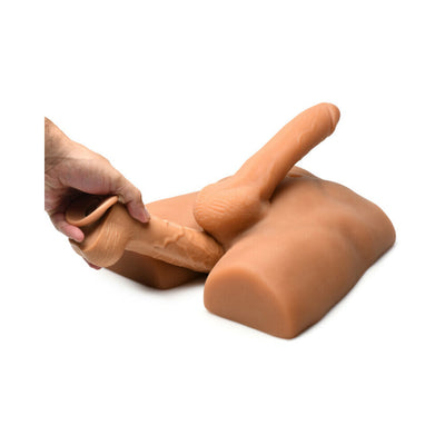 Medium-sized jock ass masturbator with a poseable 7-inch dildo, shown being adjusted by hand on a white background.