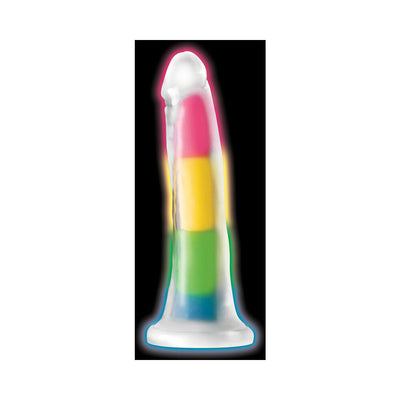 Rainbow-colored silicone dildo with glow-in-the-dark feature and suction cup base on black background