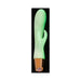 Glow-in-the-dark rabbit vibrator with soft touch silicone and rose gold base on black background.